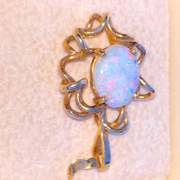Beautiful white opal set in a custom gold wire